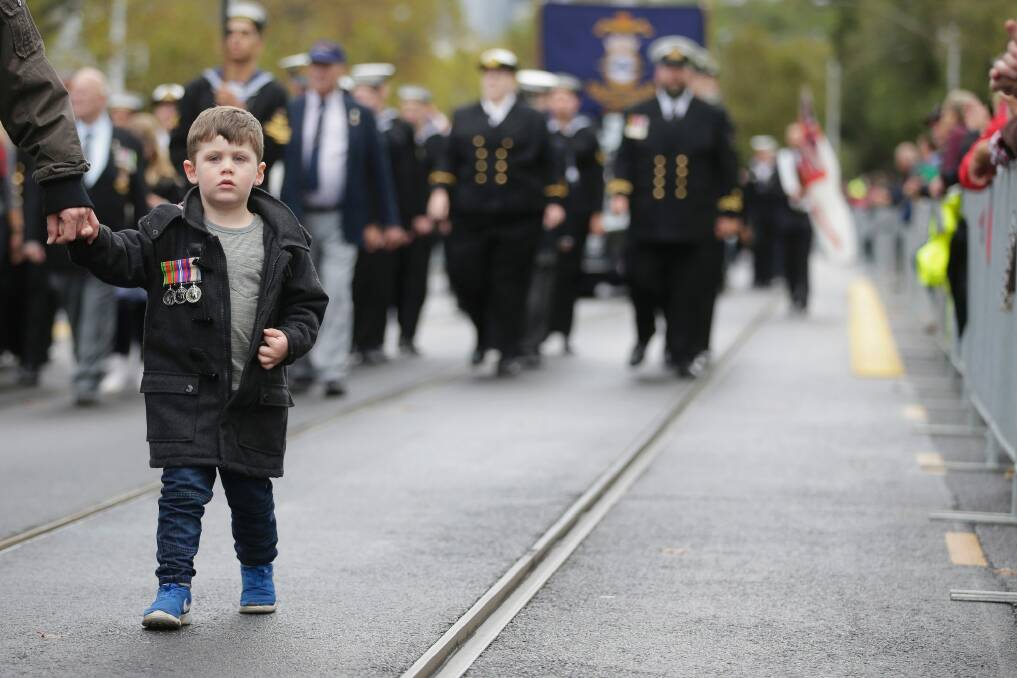  A young boy takes part in the ANZAC Day parade.  Photo: Darrian Traynor
