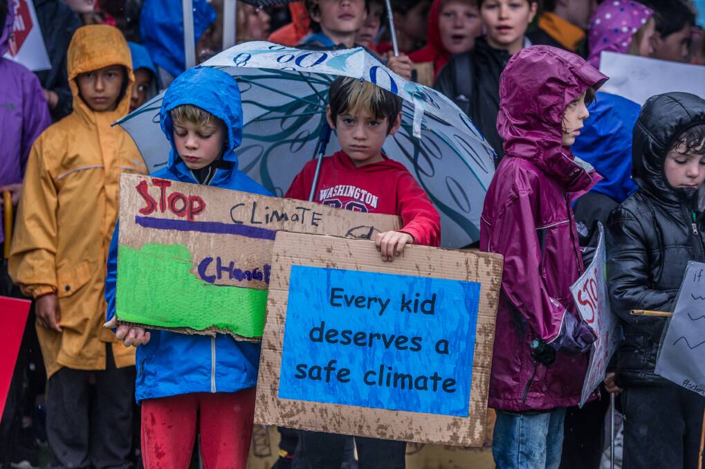 Canberra students braved the rain to protest outside Parliament House during last November's school climate strike. Photo: Karleen Minney