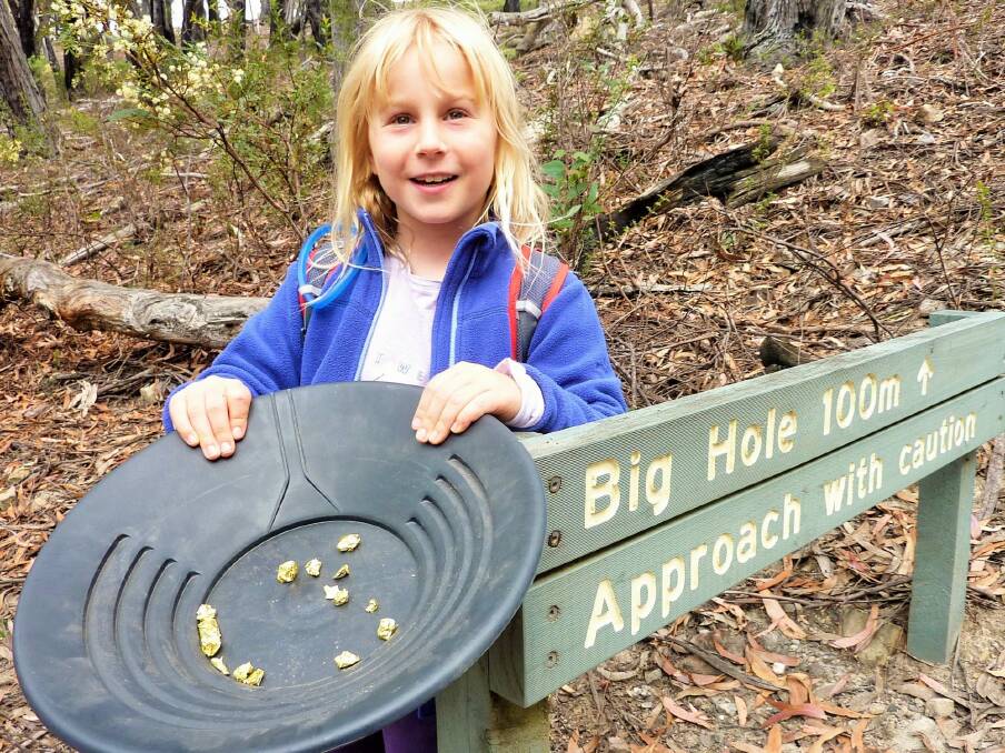 Sarah finds "gold" at the Big Hole. Photo: Tim the Yowie Man