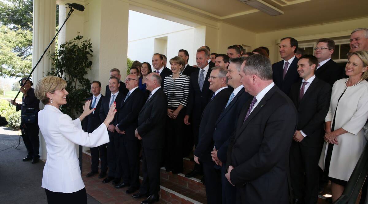 'Everybody sees the boom mic...': Foreign Affairs Julie Bishop organises the ministry photo after the swearing in ceremony on Monday. Photo: Andrew Meares