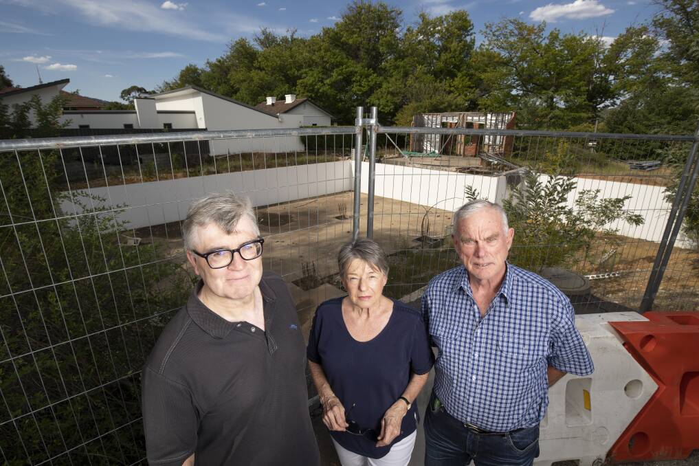 From left: David Harvey, Chris Windsor, and Graeme Windsor from the Yarralumla Residents Association have been trying to get the ACT government to take back a dormant block. Photo: Sitthixay Ditthavong