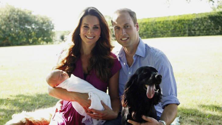Catherine, Duchess of Cambridge and Prince William, Duke of Cambridge pose for a photograph with their son, Prince George Alexander Louis of Cambridge.