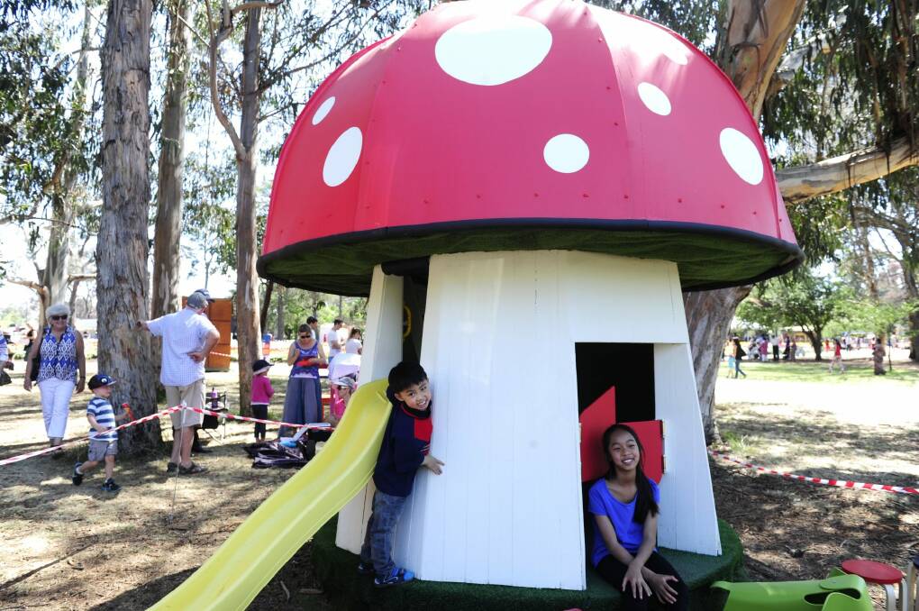 Mushroom magic:   Keiran Chu, 4, and sister Jacinta, 11, play in their cubby house after their parents, Helen and Ian Chu, made the winning bid of $16,000. Photo: Melissa Adams