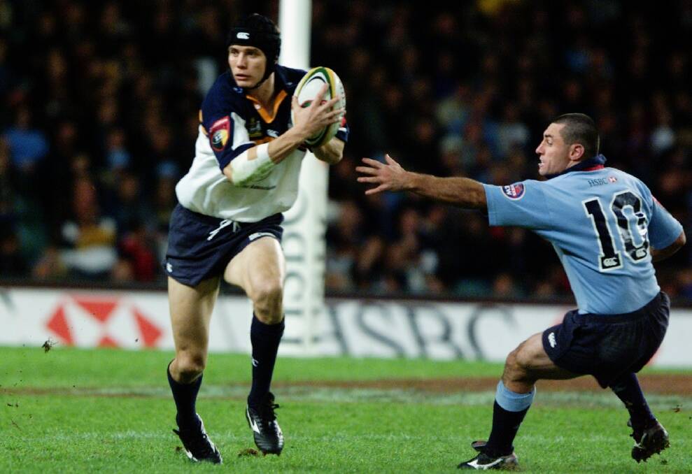 Stephen Larkham playing for the Brumbies during his decorated career. Photo: Tim Clayton