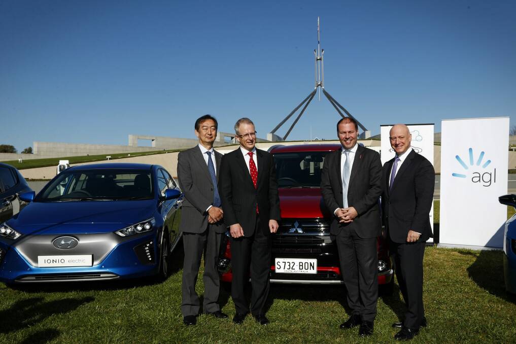 Mitsubishi CEO Mutsuhito Oshikiri, Minister for Urban Infrastructure Paul Fletcher, Minister for Environment and Energy Josh Frydenberg and AGL CEO Andy Vesy during an electric car event on the front lawn of Parliament House in Canberra on Monday 22 May 2017. fedpol Photo: Alex Ellinghausen Photo: Alex Ellinghausen