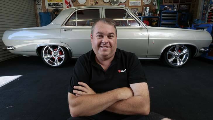 Stephen Booth at home in Banks with his 1967 HR Holden Premier. Photo: Jeffrey Chan