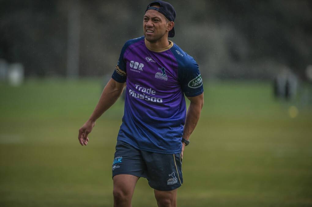 Christian Lealiifano leaves the field clutching his hamstring during Wednesday's training.  Photo: Karleen Minney