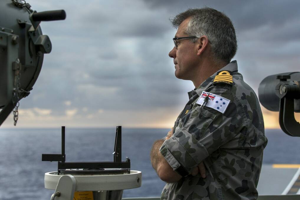 The commanding officer of HMAS Canberra, Captain Christopher Smith, on the bridge wing during Sea Series 2015. Photo: ADF