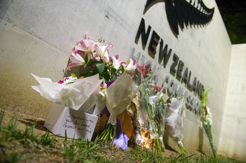 Flowers left at the New Zealand High Commission in Canberra after the terrorist attack in Christchurch on Friday.  Photo: Elesa Kurtz 