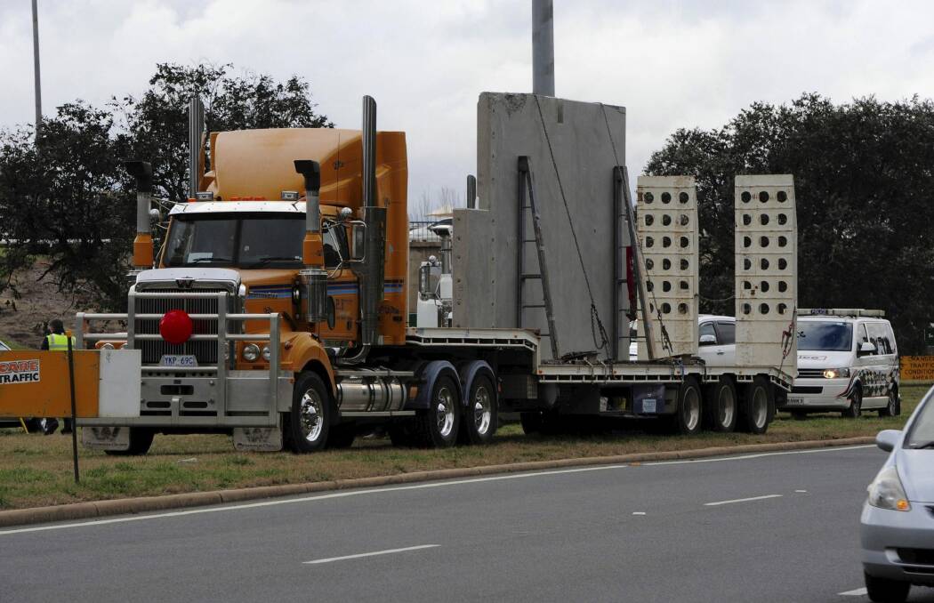 A low loader carrying pre-cast concrete appears to have brushed the underside of the Commonwealth Avenue overpass on Parkes Way heading west. Photo: Graham Tidy