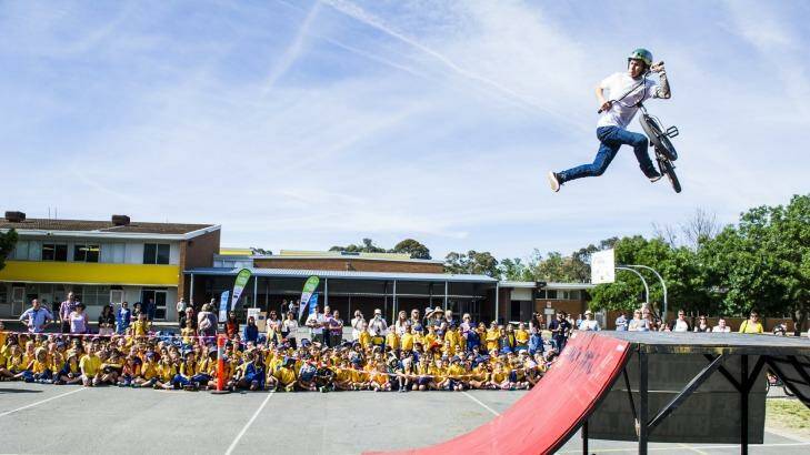 Arawang Primary School celebrate Ride or Walk to School day with Backbone BMX's Mike Ross. Photo: Rohan Thomson