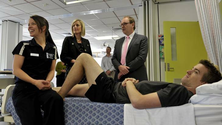 Physiotherapy students Kylie Murray and Sam Wood talk to ACT Chief Minister Katy Gallagher and University Vice Chancellor Professor Stephen Parker about the signing of the agreement for the new northside hospital yesterday. Photo: Jay Cronan