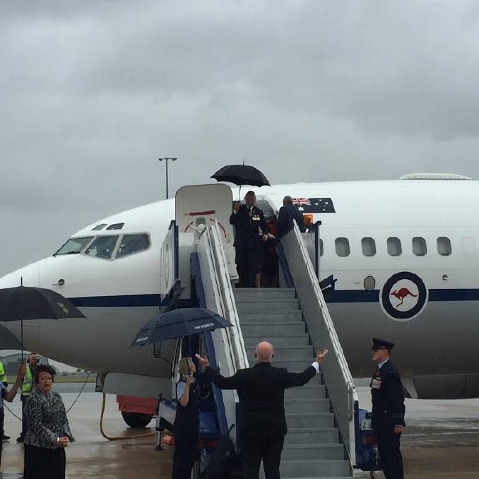 Sir Peter Cosgrove shunned an umbrella to welcome the Royals with open arms. Photo: Emma Macdonald