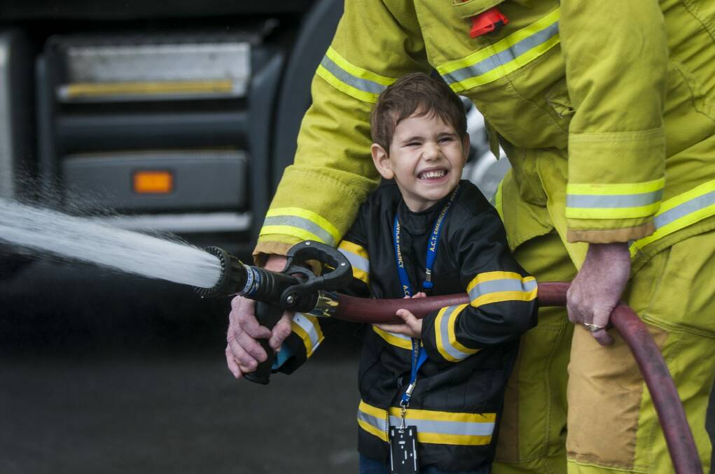 Cerebral palsy sufferer, four year old Blake Tummer gets his wish to be a fireman for a day. Photo: Karleen Minney