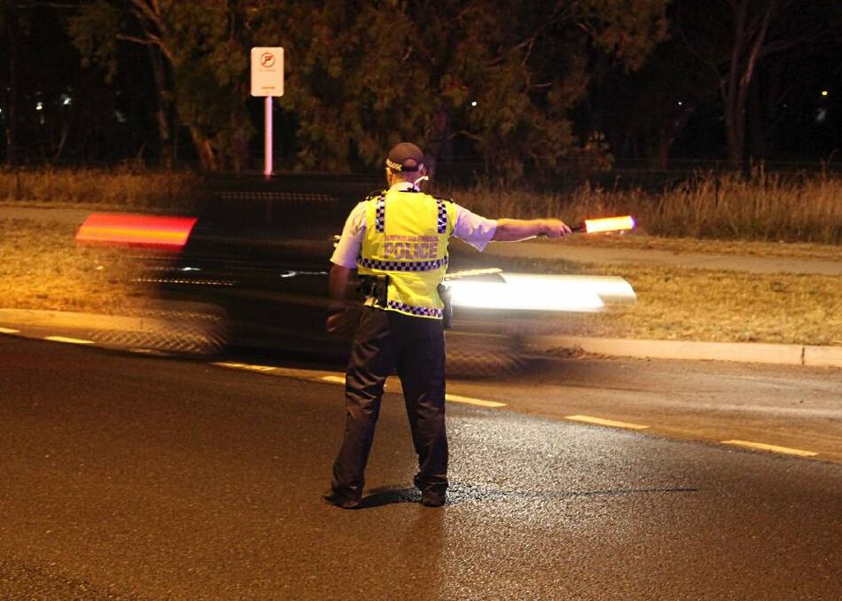 An officer pulls over a driver for a random breath test. Photo: Supplied
