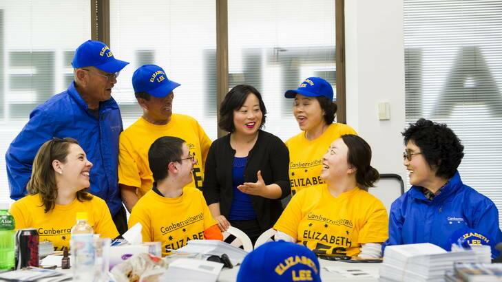 Elizabeth Lee prepares election material with her team at her office in the city. Back, from left: David Lee, John Lee (father), Elizabeth Lee, Cecilia Lee (mother), Front, from left: Candice Burch, Samuel Gordon-Stewart, Rosa Lee (sister), and Kim Lee. Photo: Rohan Thomson