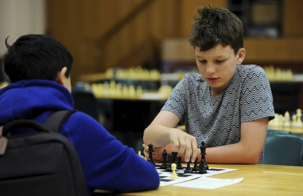 Henry Slater-Jones, 12, of Brisbane, is competing in the Australian Junior Chess Championships at Canberra Boys Grammar
School.  Photo: Graham Tidy
