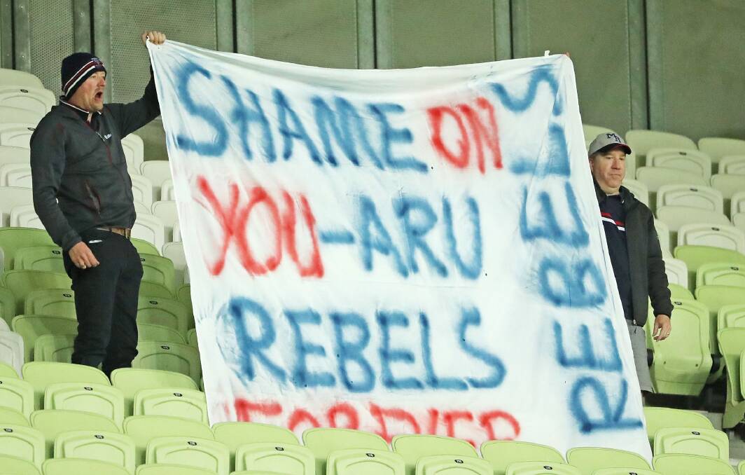 Rebels supporters in the crowd hold a sign aloft during the match between the Rebels and the Brumbies. Photo: Getty Images