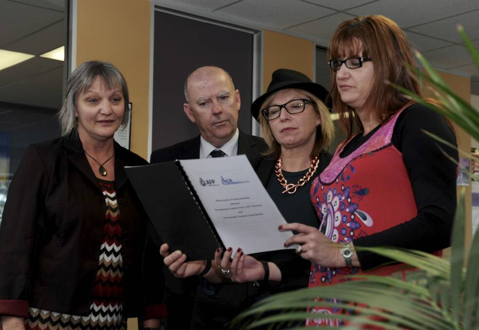 Domestic Violence Crisis Service client service director Dearne Weaver, Victims of Crime commissioner John Hinchey, Australian of the Year Rosie Batty and DVCS executive director
Mirjana Wilson.  Photo: Graham Tidy