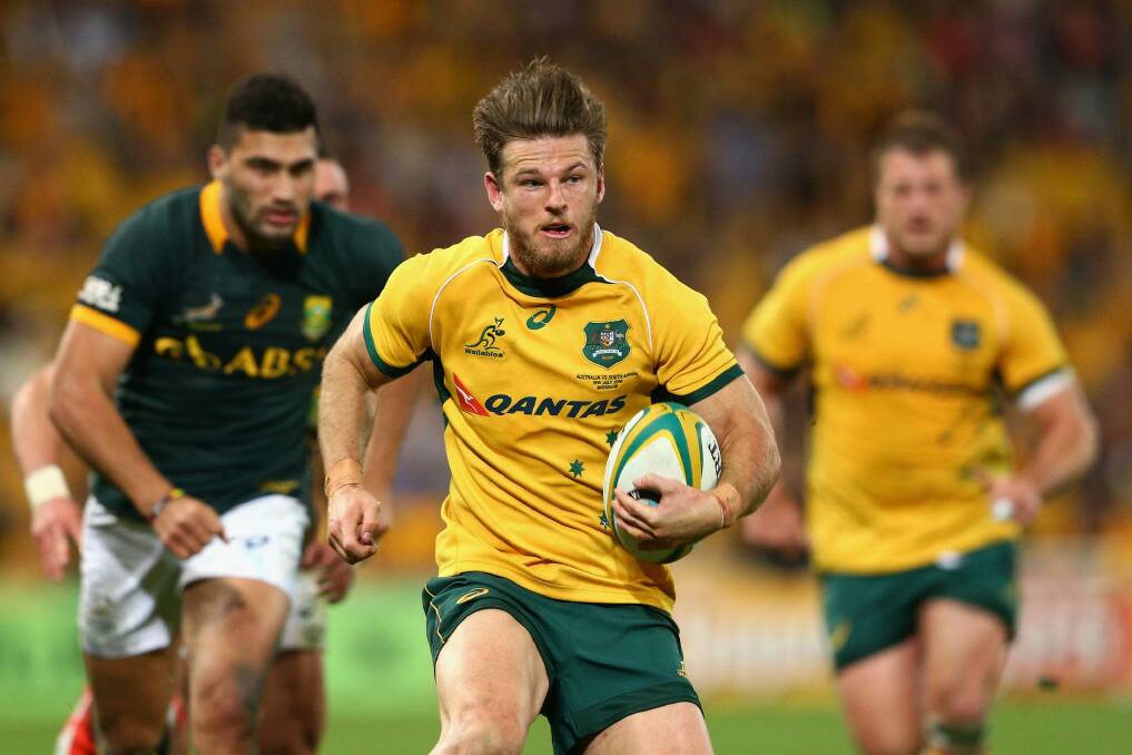 Excited: Rob Horne of the Wallabies runs the ball against the Springboks in Brisbane.  Photo: Getty Images