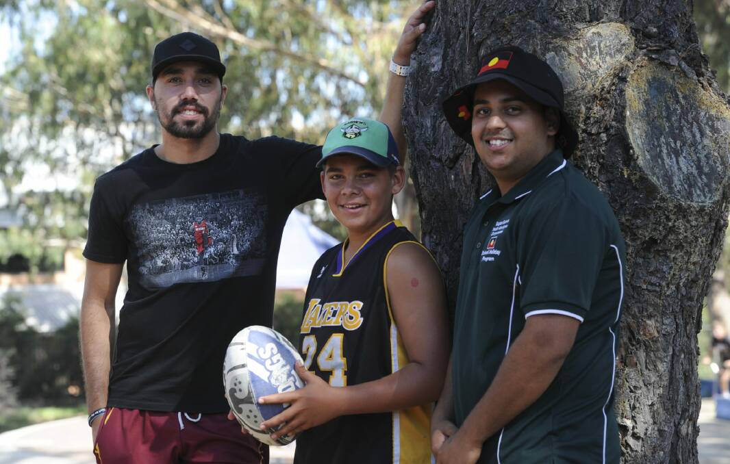 Reeion Murray, 20, left, Jordan Williams, 14, both of Queanbeyan, and Sonione Wakabut Rogers, 20, of Kambah at a National Youth Week event at the Gugan Gulwan Aboriginal Community Centre at Erindale on Thursday. Photo: Graham Tidy