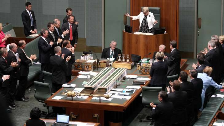 Retiring Clerk of the House of Representatives Bernard Wright receives a standing ovation at Parliament House. Photo: Alex Ellinghausen