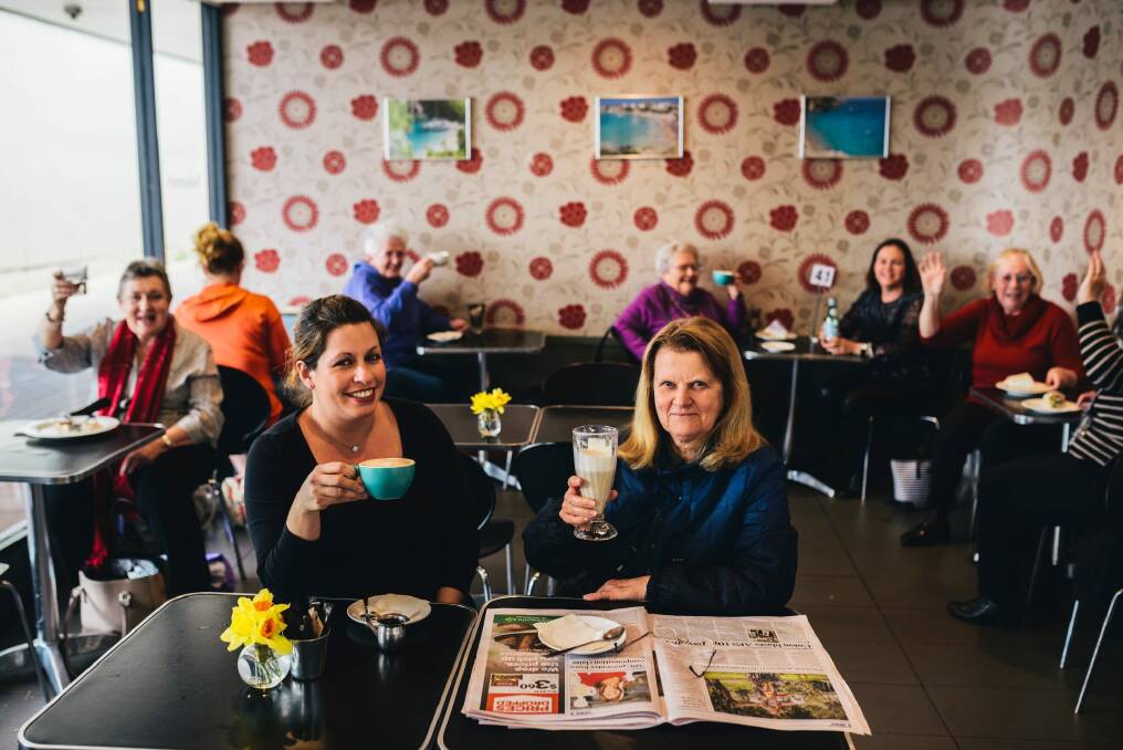 Customers at Sakeena's Cafe at Cooleman Court  celebrate news it will not be closing down with
Maria Stavrakis  (front left) who has run the business with her family, including parents Despina and Minas for more than 15 years. Photo: Rohan Thomson