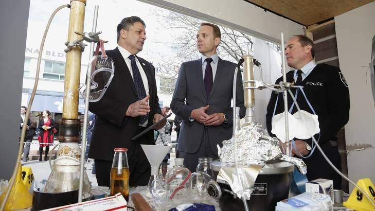 Director of Crime Stoppers ACT Brian Roach and Minister for Police and Emergency Services Simon Corbell are shown by Deputy Chief Police Officer David Pryce a mock drug lab that ACT Policing set up at Garema Place for the Launch of ACT Policing's Anti Illicit Drug Campaign. Photo: Jeffrey Chan