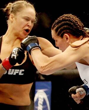About-face: Ex-Olympic judo medallist Ronda Rousey helped change attitudes towards female UFC combatants.