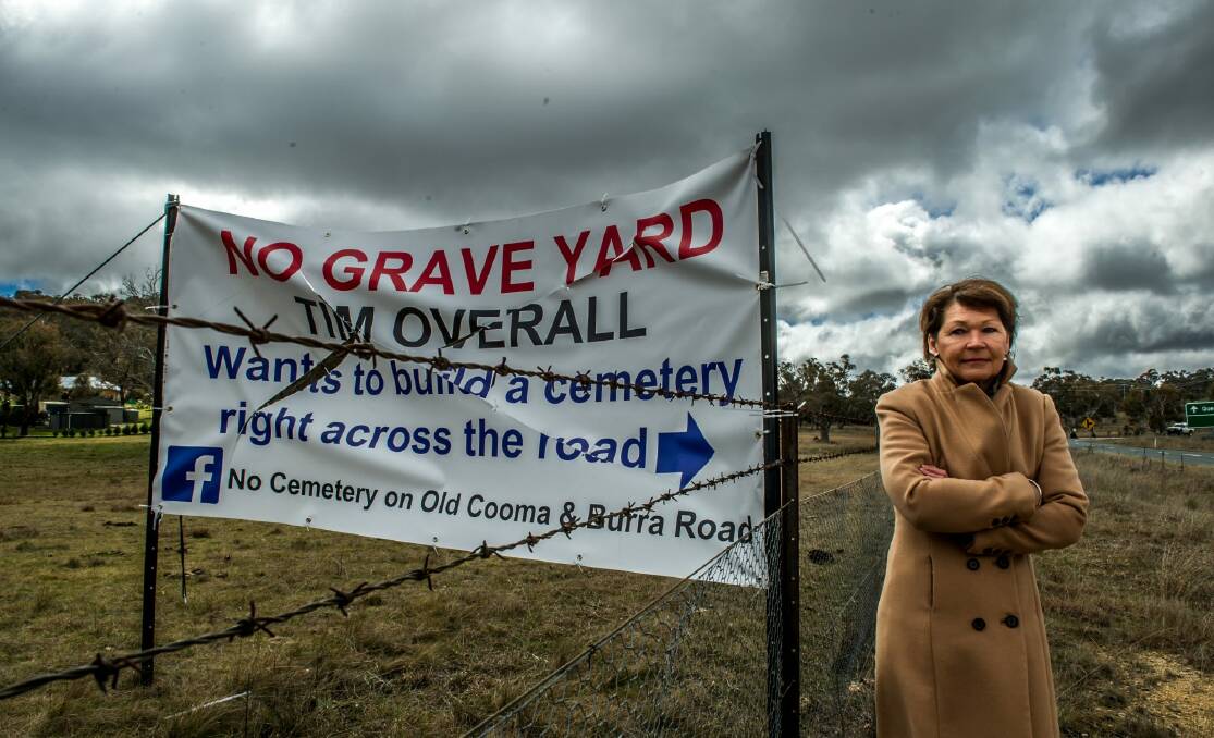 Wendy Hubbard with the sign targeting the proposed cemetery.  Photo: Karleen Minney