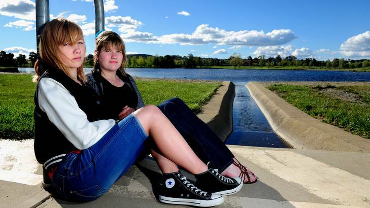 Emily, 14 and Tessa Bright at Yerrabi Pond where they and another friend were swept in. Photo: Melissa Adams