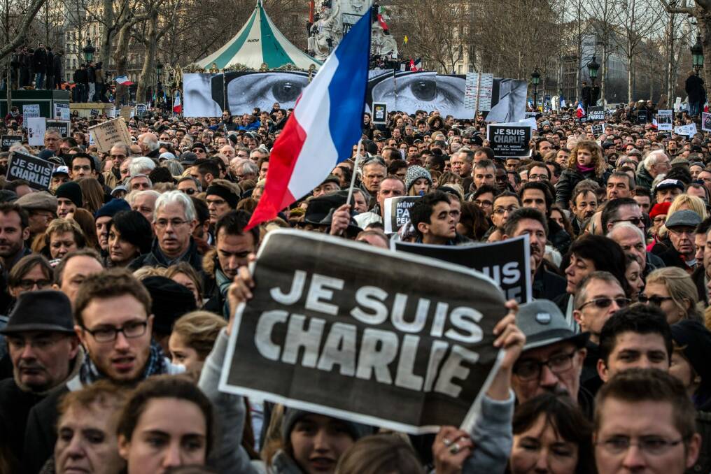 Demonstrators make their way along Place de la Republique during a mass unity rally following the terrorist attacks in Paris.  Photo: David Ramos