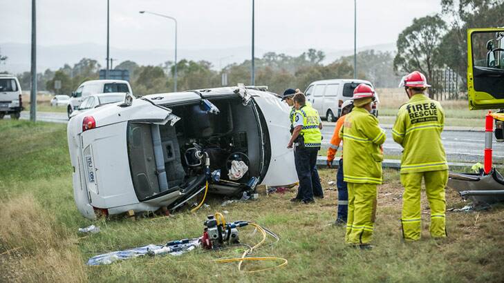 Emergency workers have had to cut the occupants out of a car after a serious accident in southern Canberra. Photo: Rohan Thomson