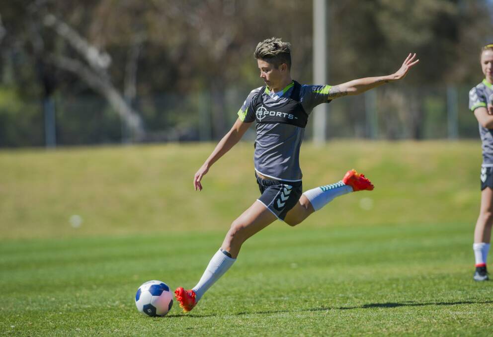Canberra United striker Michelle Heyman launches into a shot at training on Saturday. Photo: Jamila Toderas