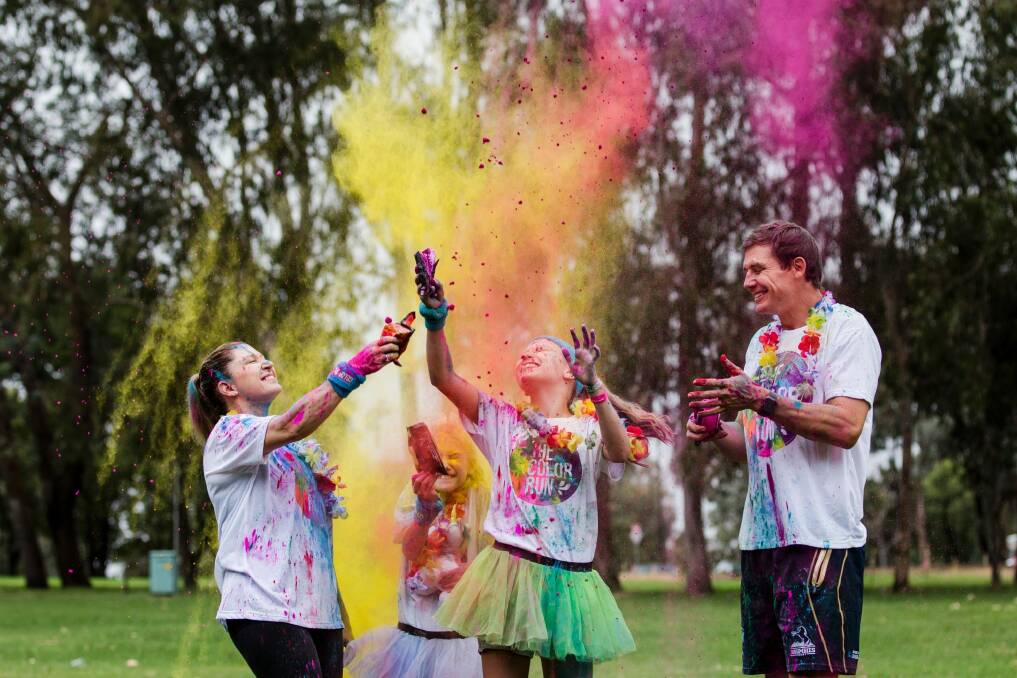 Jacqueline and Stephen Larkham with their children Tiahna 10, and Jaimee 13 preparing for the Canberra Color Run. Photo: Jamila Toderas