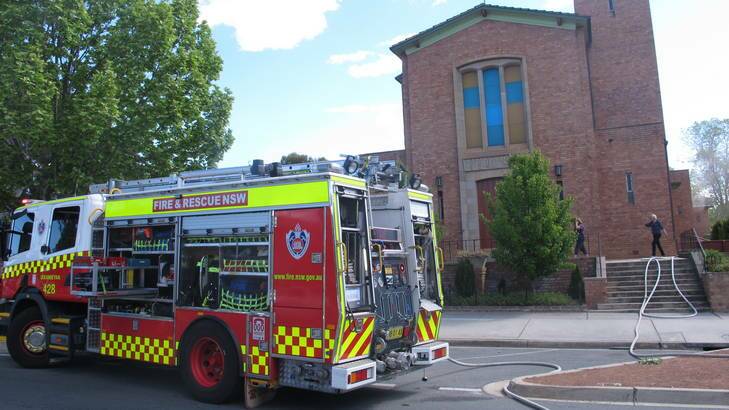 Firefighters fight a blaze that threatened to completely destroy St Raphael's Church on Lowe Street in Queanbeyan on Friday. Photo: Supplied