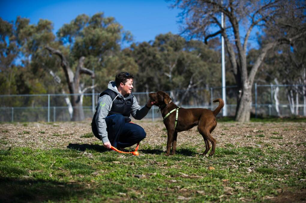 Franklin resident Sharyn Butts with her dog River at the O'Connor dog park, one of few areas in Canberra where dogs are allowed off-leash. Photo: Rohan Thomson