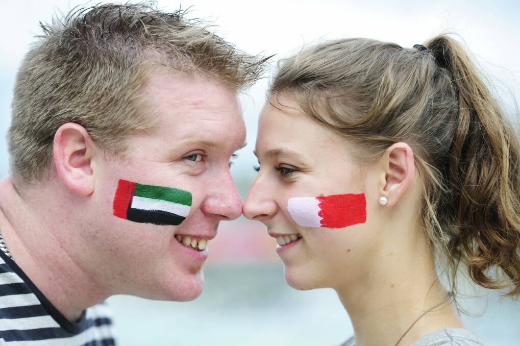 Sam Parker, of Albury, and Cassie Lee, of Bruce, at Canberra Stadium to see UAE take on Qatar. Photo: Melissa Adams