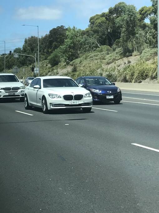 Prime Minister Scott Morrison rides in his armoured BMW 750iL, shadowed by his protective officers in their BMW X5, on his way to the Australian Open tennis. Photo: Sally Whyte