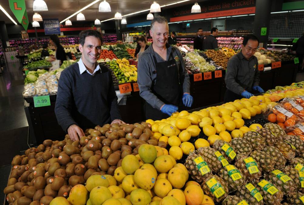 Theo Koundouris, left, at the Canberra Centre Supabarn store which has now been bought out by Coles. Photo: Graham Tidy