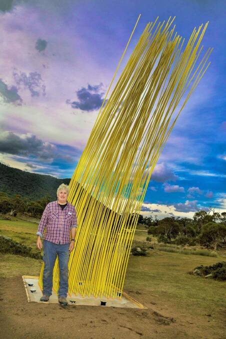 Konstantin Dimopoulos with his sculpture, Yellow, at Wildbrumby Distillery near Thredbo. Photo: Tim the Yowie Man