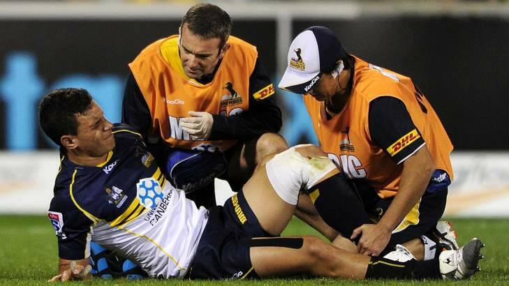 Matt Toomua of the Brumbies is forced off with a knee injury. Photo: Stuart Walmsley