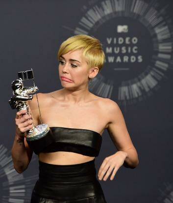Confusion: Miley Cyrus poses at the 2014 MTV Video Music Awards. Photo: AFP