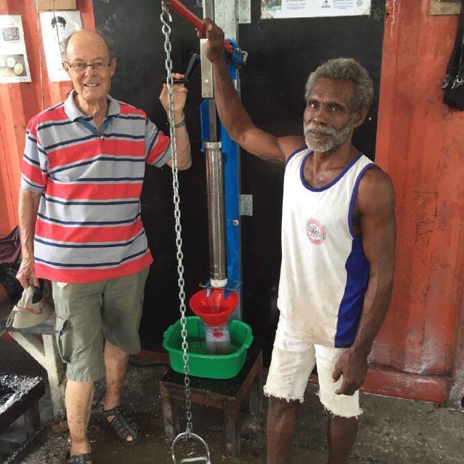 Dr Etherington with Peter, a key coconut oil producer in the Solomon Islands. Photo: Supplied
