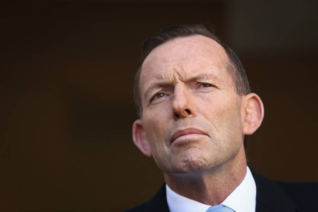 Tony Abbott confirmed that Australia will take more than 4400 refugees from Syria, and said that RAAF operations within Syrian airspace were necessary to counter "the rise of a new barbarism inside this country". Photo: Alex Ellinghausen