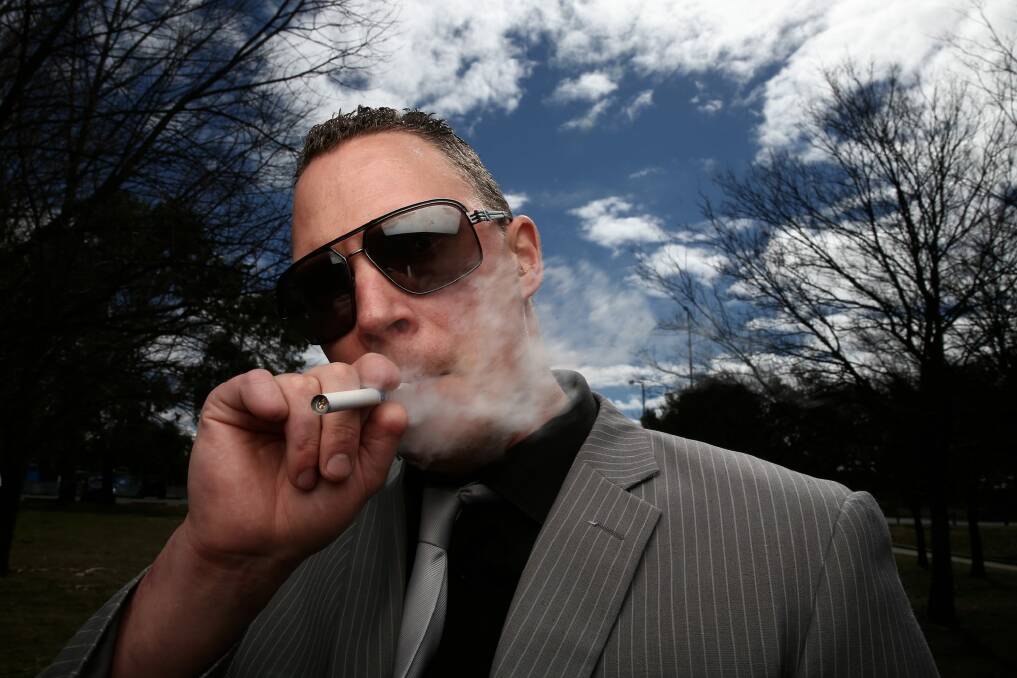 More people, like Drew, from Canberra, are using e-cigarettes. Photo: Alex Ellinghausen 