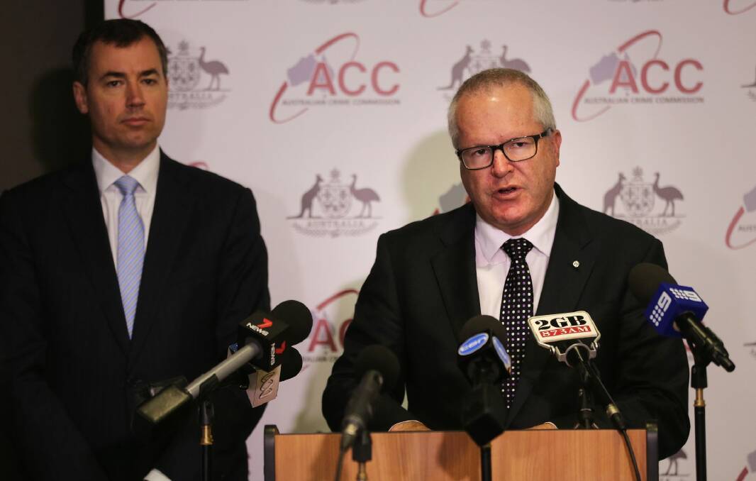 Justice Mnister Michael Keenan, left,  and Australian Crime Commission chief Chris Dawson. The government plans to incorporate the  Australian Institute of Criminology within the ACC. Photo: Kate Geraghty