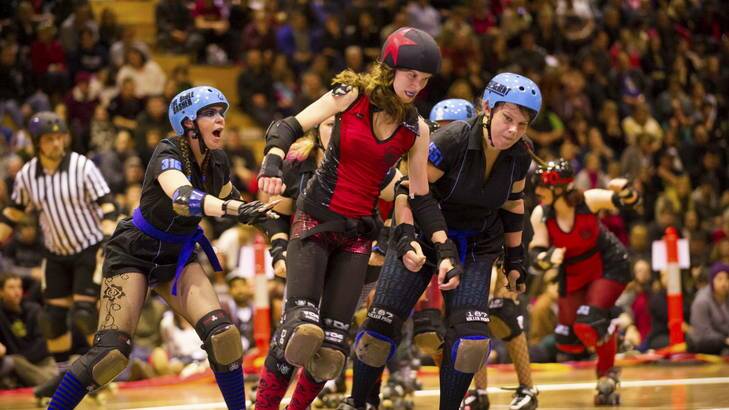 Roller Derby bout between the Red Bellied Black Hearts and the Black 'n' Blue Belles. Photo: Brett Sargeant