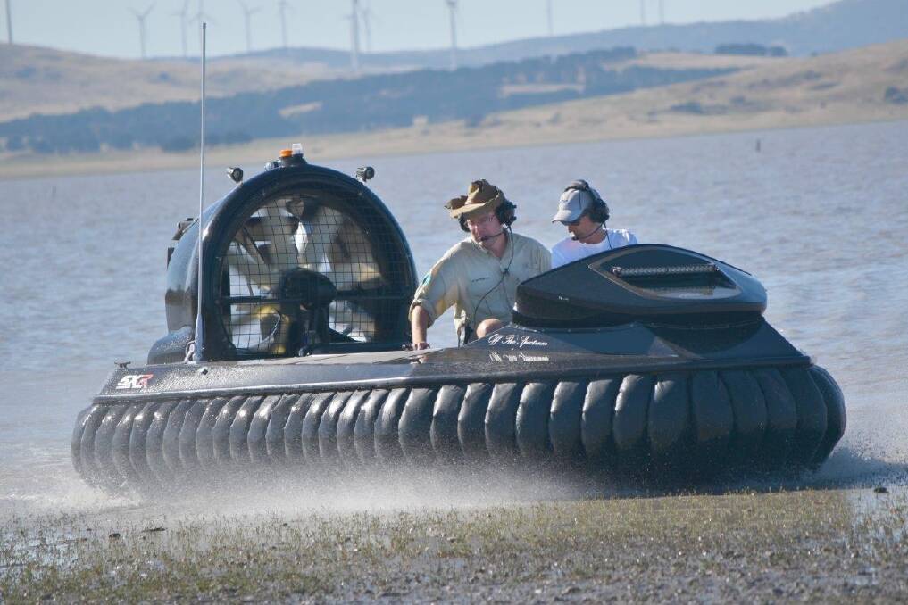 Tim the Yowie Man joins Mick Nell on a hovercraft flight around Lake George. Photo: Tim the Yowie Man