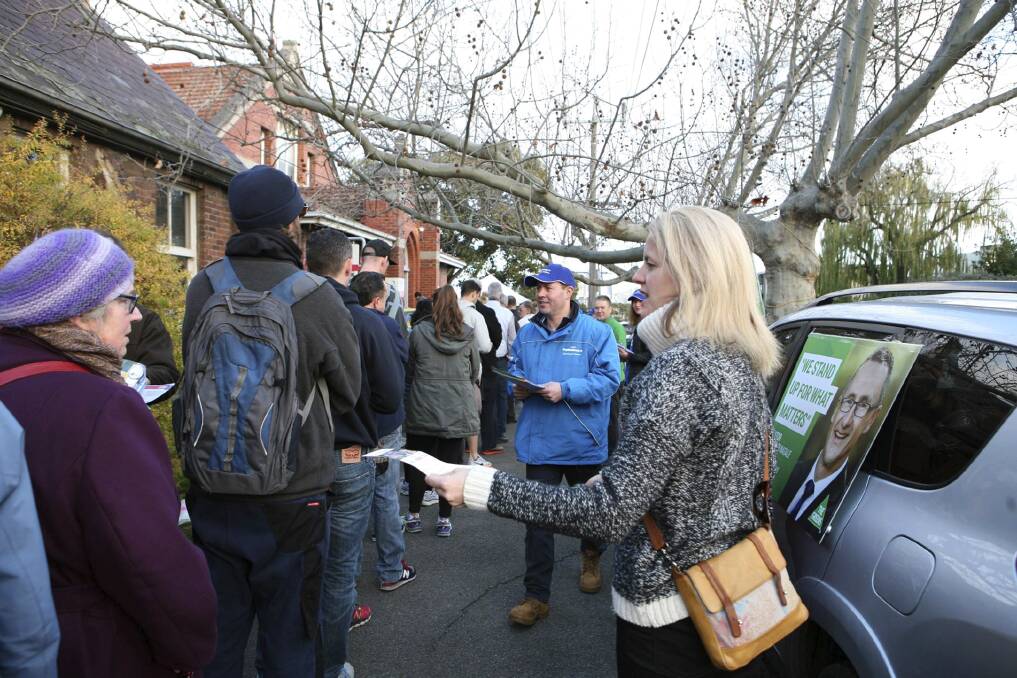 Josh Frydenberg hands out flyers to voters outside a polling station in 2016. Photo: Josh Frydenberg/Facebook